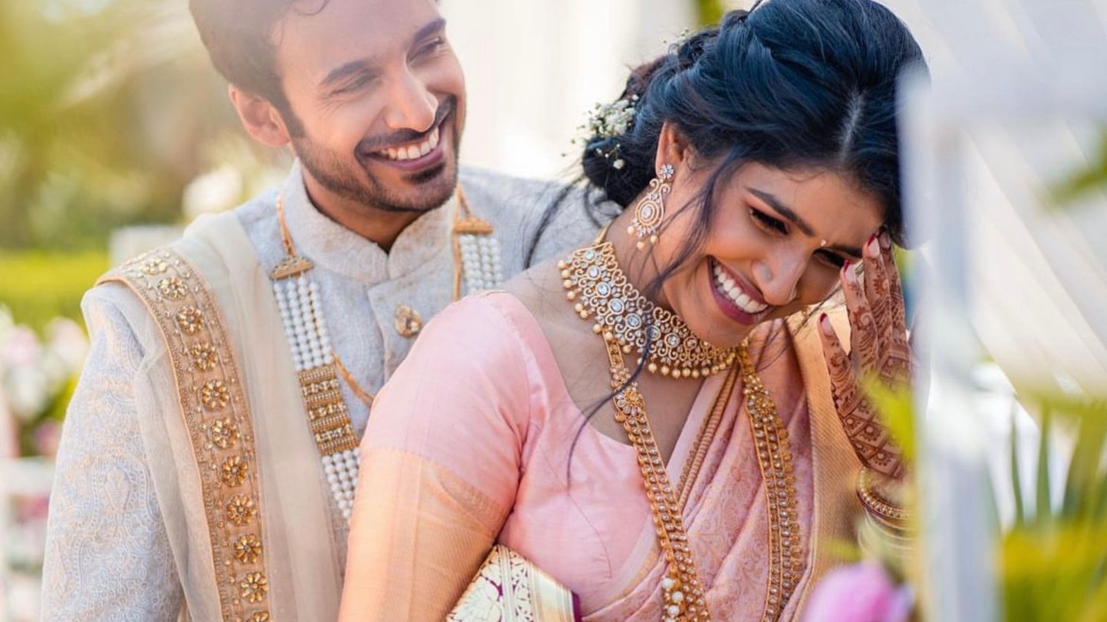 Bride and groom laughing together